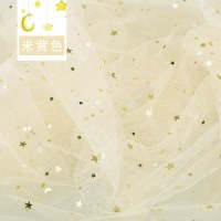 家柏饰(CORATED)镭射幻彩布料 七彩烫金布背景布反光演出服diy面料星星纱 米黄色/1米价