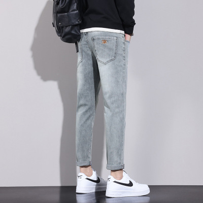当季抖音牛仔裤男士痞帅潮牌百搭弹力破洞小脚裤男生