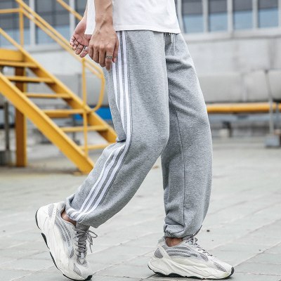 珂卡慕(kekamu)三条白杠裤子春新款运动裤男针织长裤休闲束脚哈伦裤棉