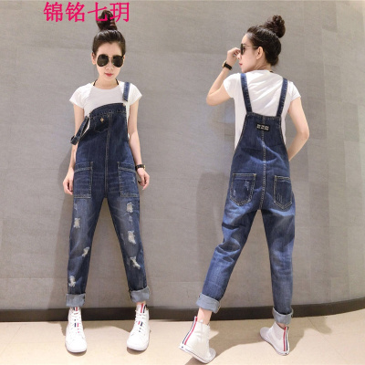 锦铭七玥欧洲站2018夏装欧货潮新款女装时尚修身破洞口袋脚牛仔背带裤女